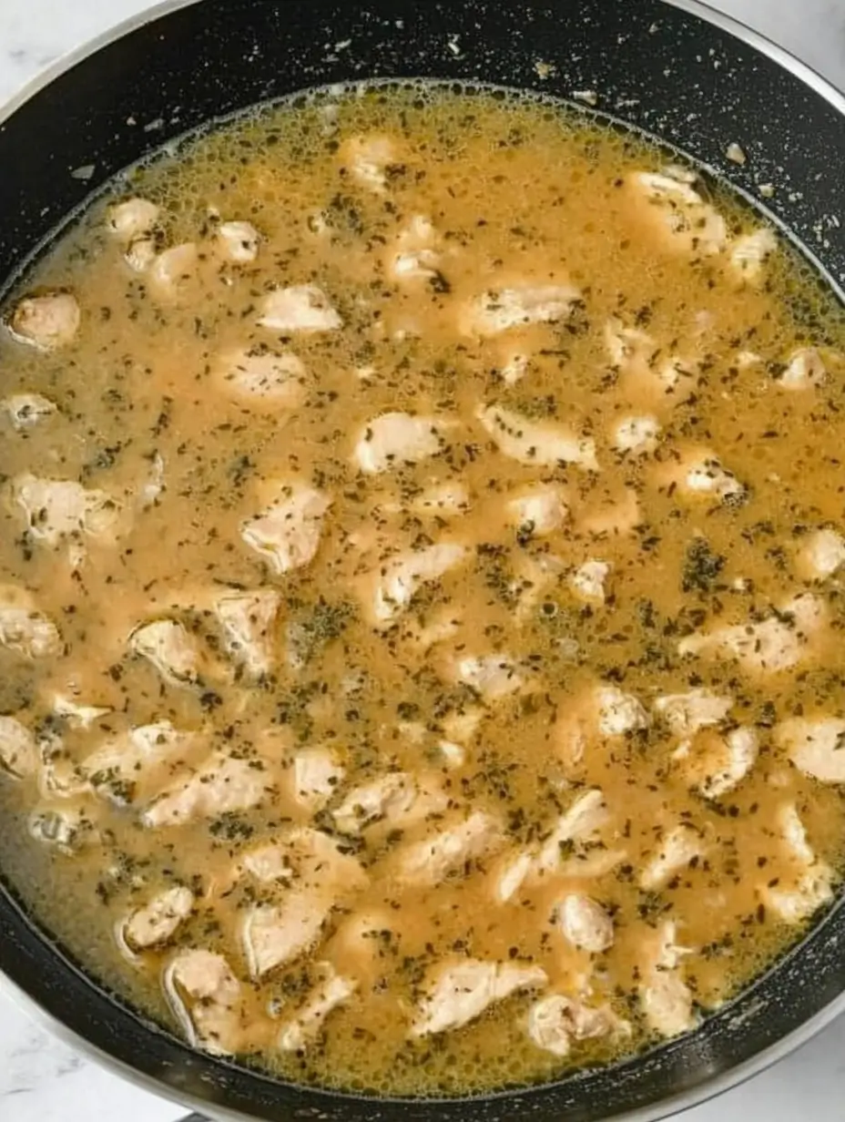 seasoned-chicken-simmering-in-broth
