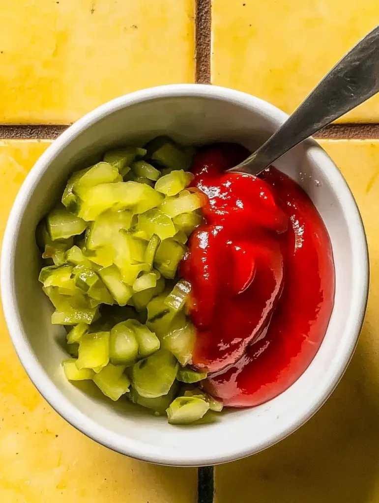 A small bowl containing chopped pickles and ketchup ready to be mixed for the Big Mac-inspired sauce.
