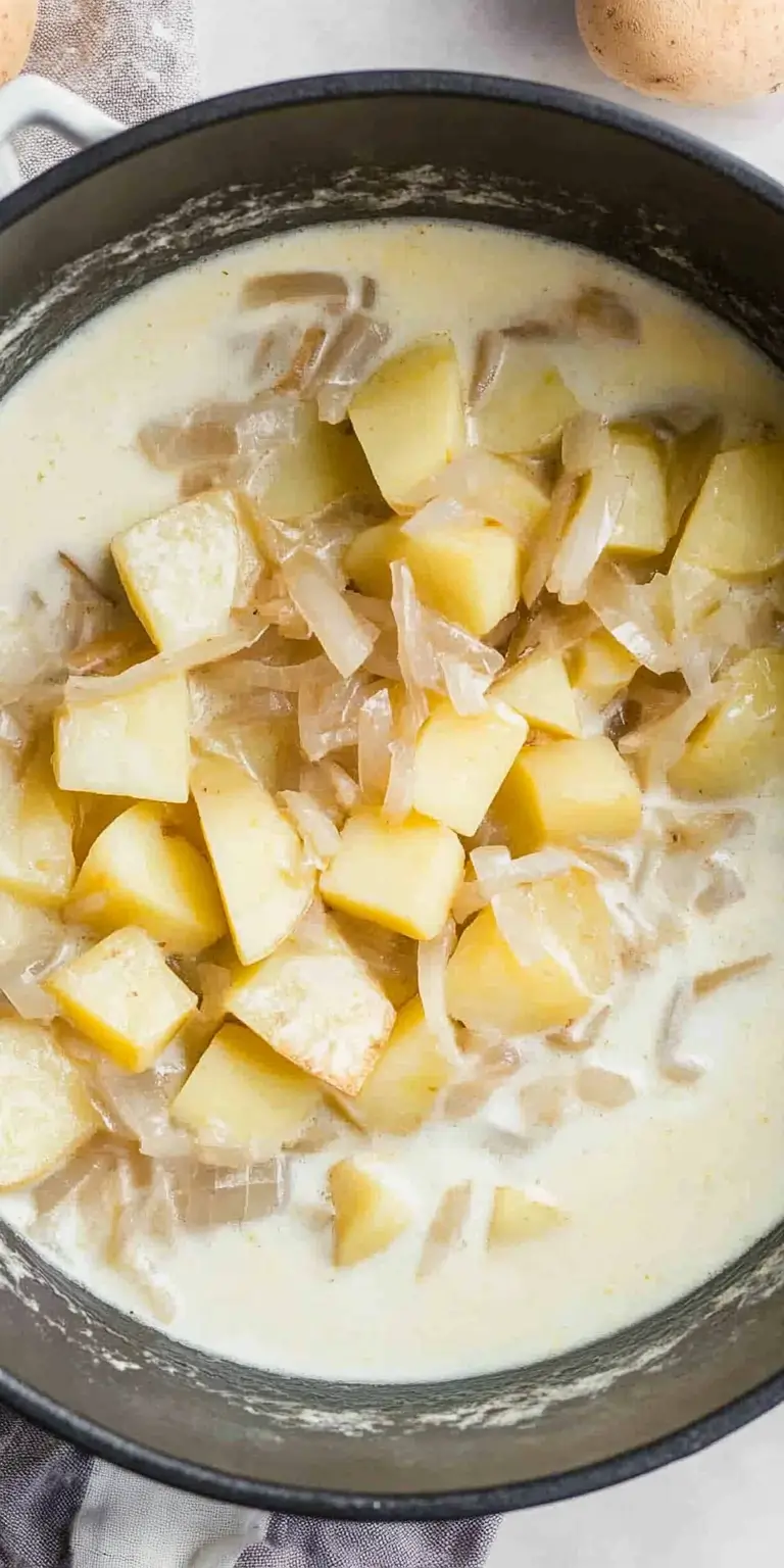 4 Ingredient Potato Soup 15 Chunks-of-diced-potatoes-and-sautéed-onions-simmering-in-creamy-soup