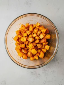 Crispy Air Fryer Breakfast Potatoes 24 Perfectly-Seasoned-Air-Fryer-Potatoes-in-Clear-Bowl