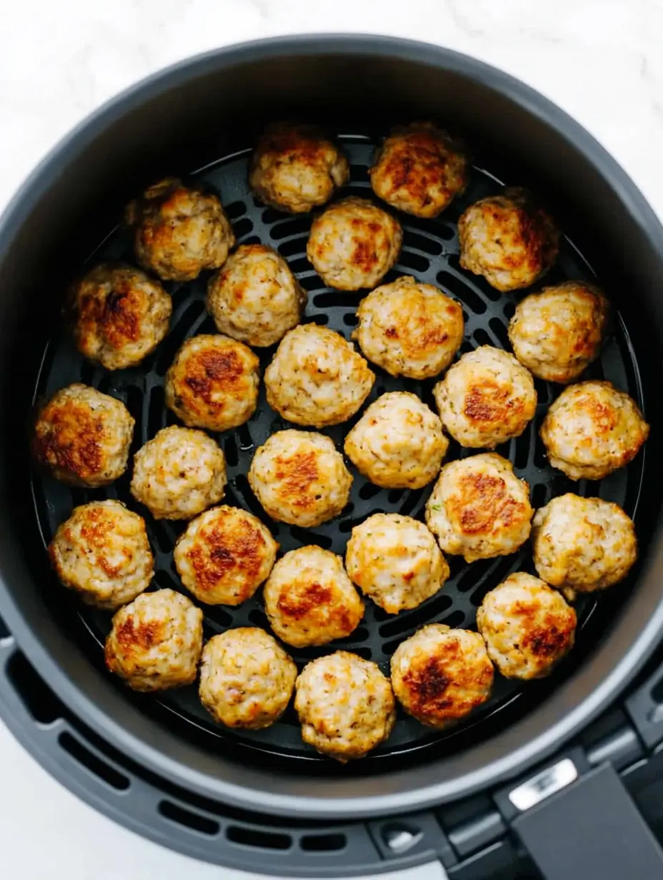 air-fryer-basket-with-golden-brown-frozen-meatballs