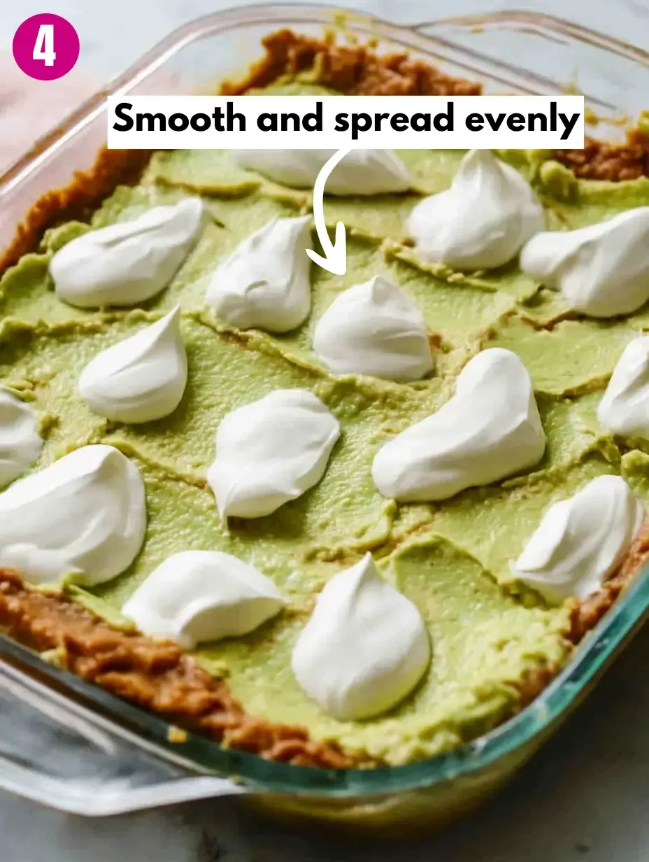 The BEST 7-Layer Bean Dip Recipe 15 Smooth-and-spread-evenly