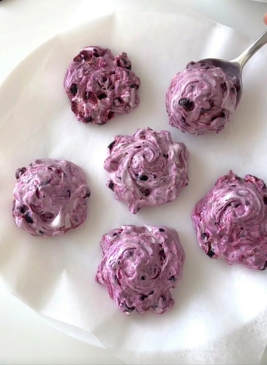 blueberry yogurt clusters scooped onto parchment