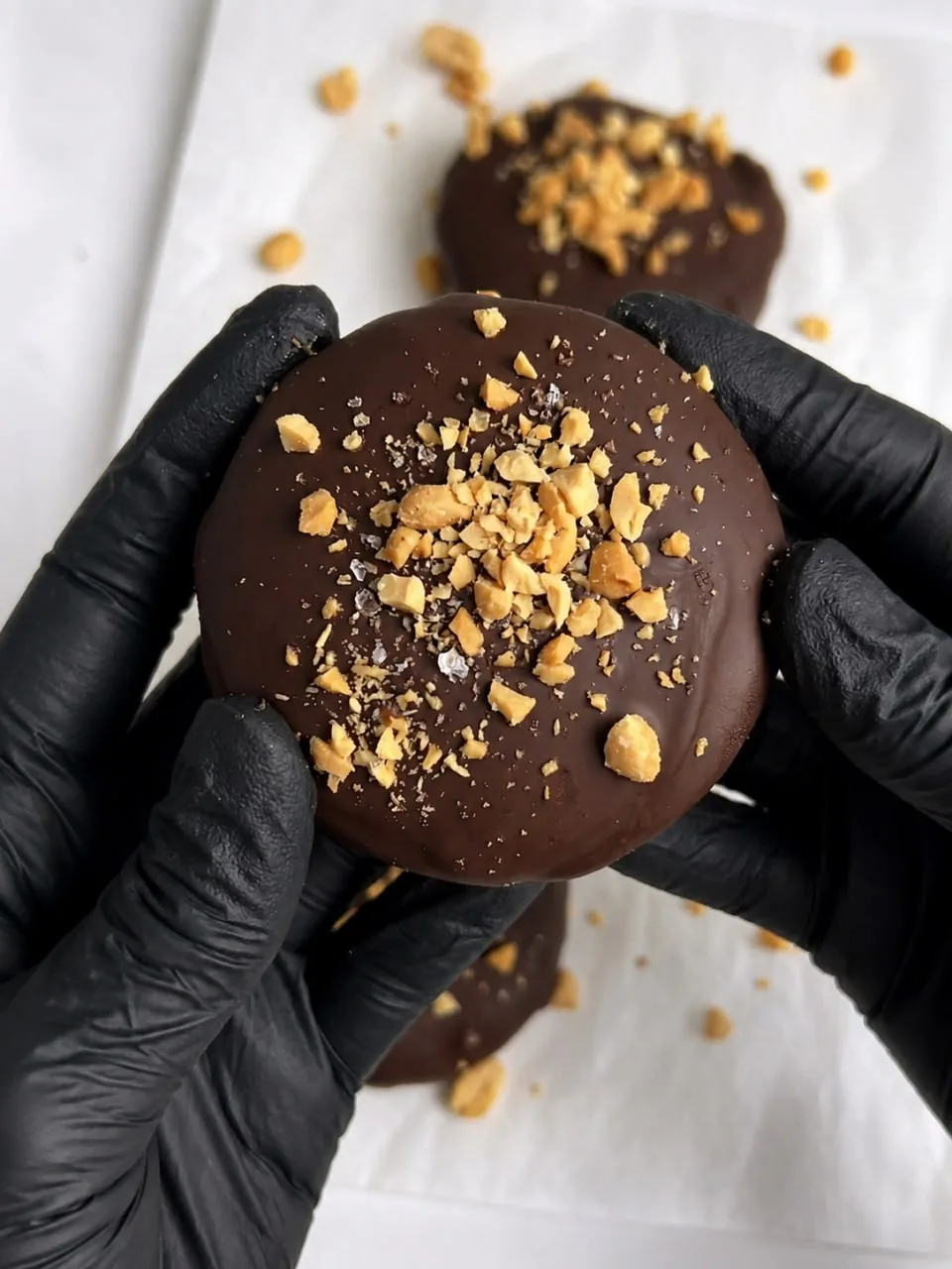 Chocolate Peanut Butter Yogurt Bites 8 hands-holding-chocolate-peanut-butter-yogurt-bite-with-nuts
