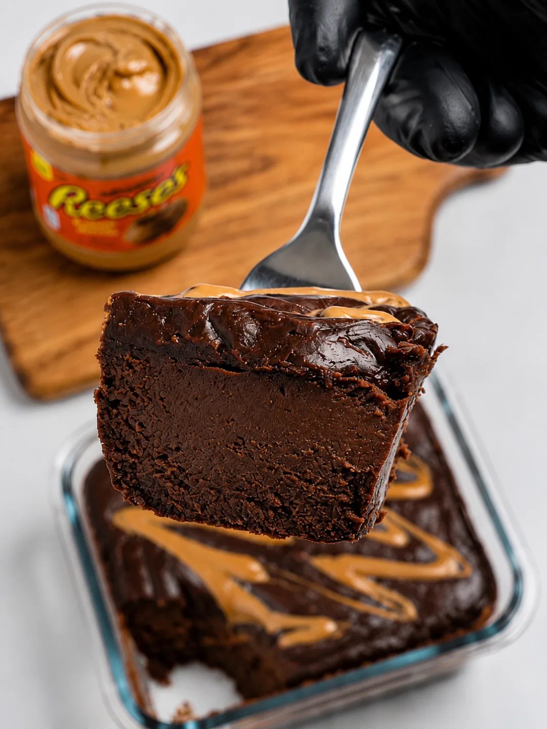 protein-reeses-cheesecake Protein Reese's Cheesecake in a ramekin with a golden peanut butter swirl on top